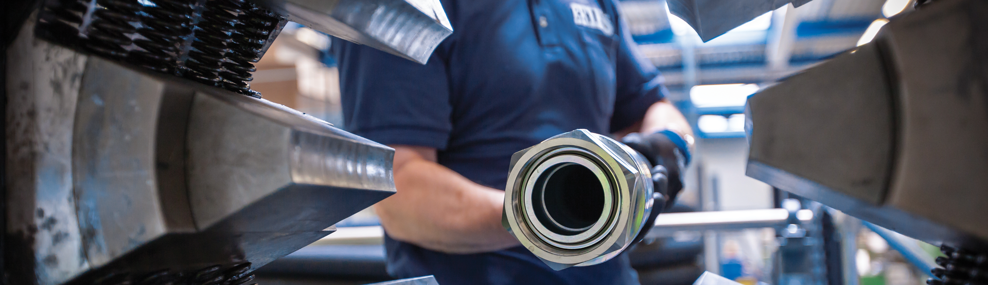 Goodall HOse up close in an industry setting with a member of ERIKS holding the hose at the camera