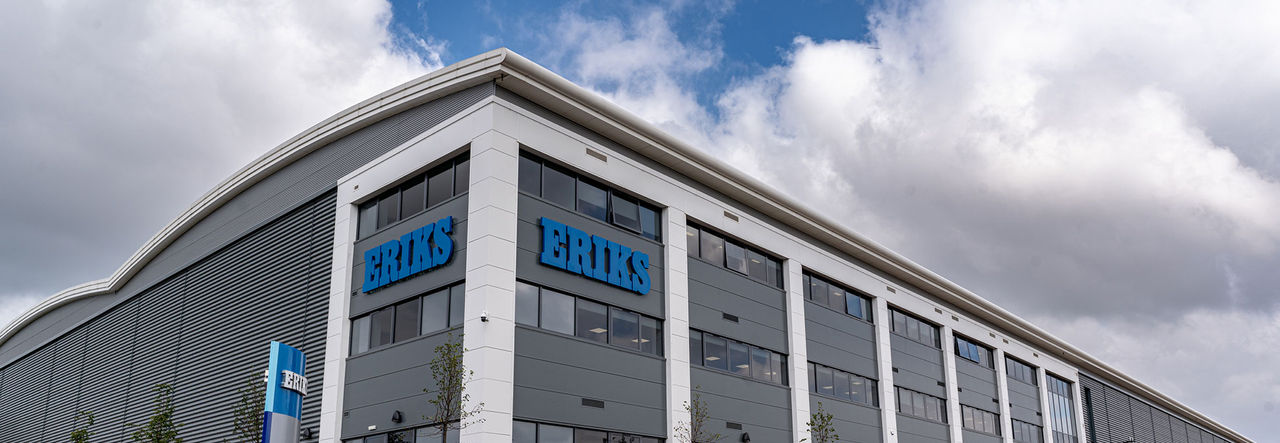 FCE Oldbury Head Office of ERIKS Industrial Services outside build image against a blue sky and clouds background