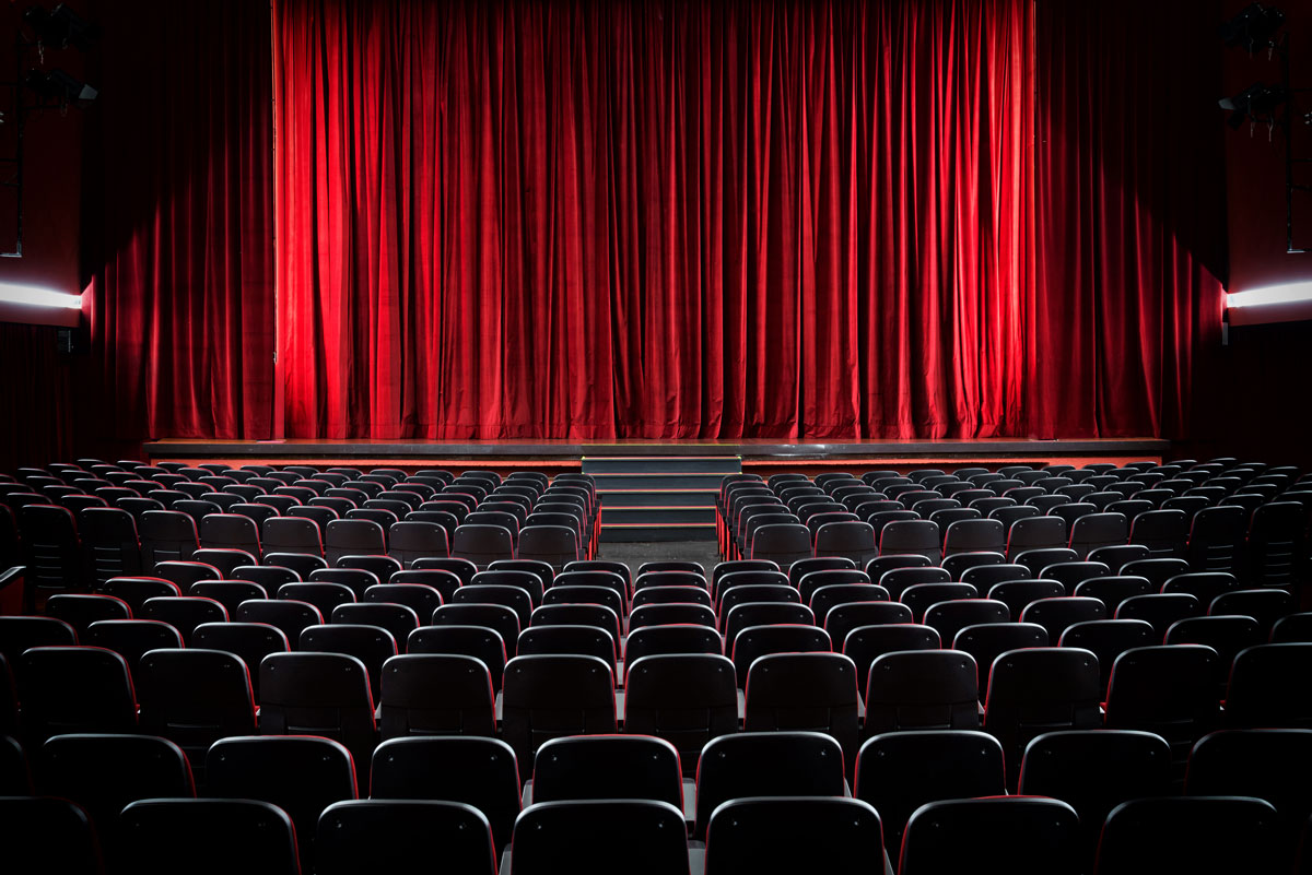 Darkened empty movie theatre and stage