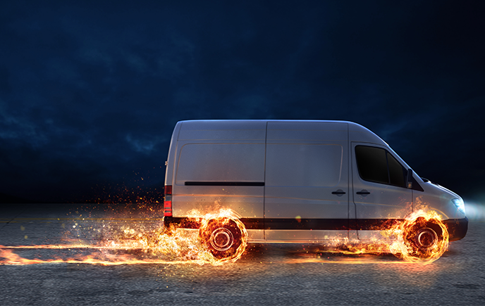 van with wheels on fire