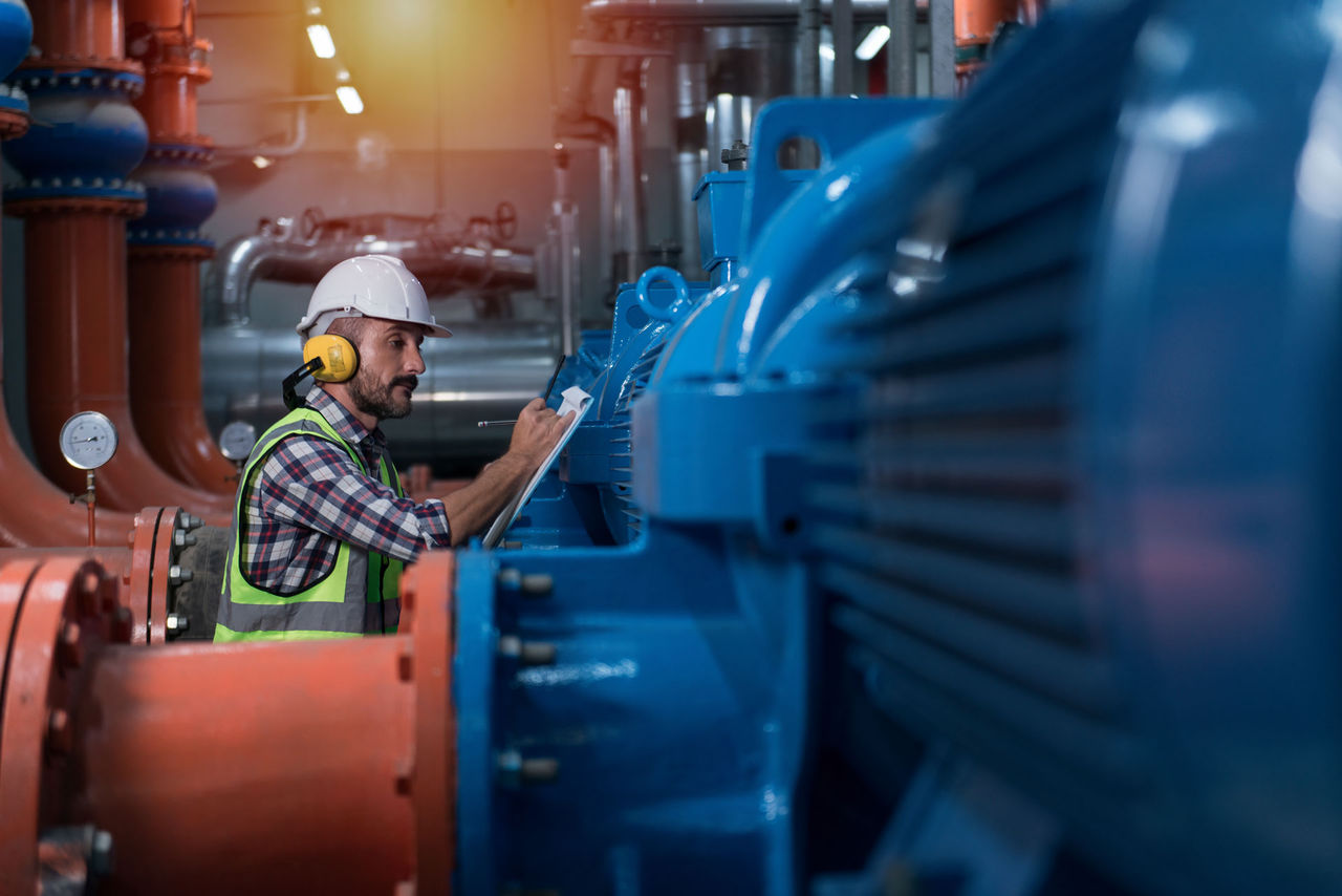 Why Best Efficiency Point (BEP) Matters in EfW Pump Systems Mechanical engineer Checking of centrifugal pump in pump room. worker working in plant room.