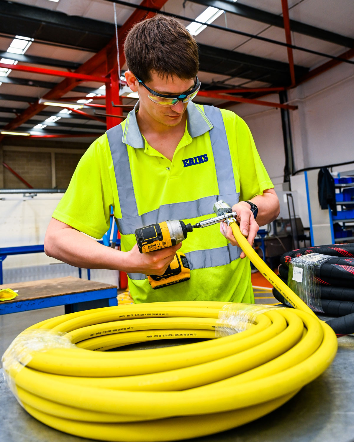 ERIKS employee working on a hose ending
