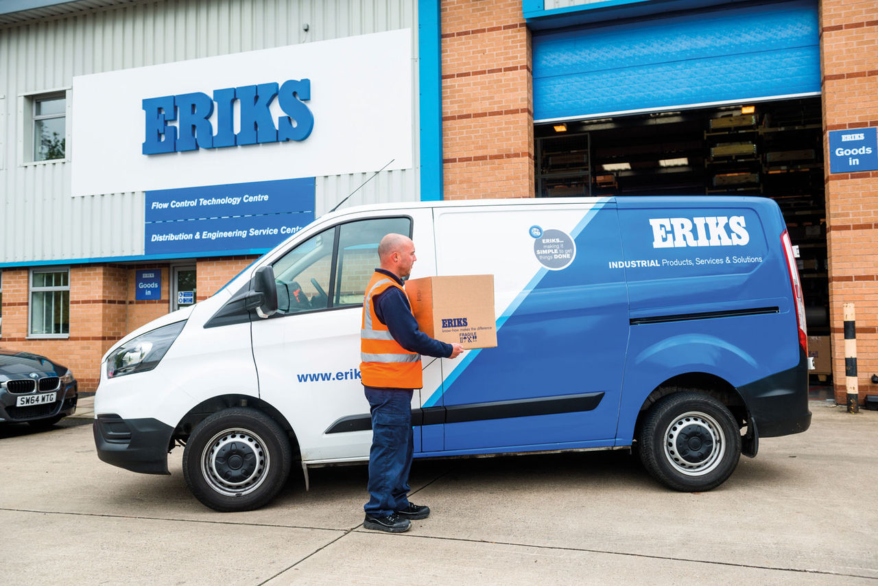ERIKS Employee outside of ERIKS Leicester carrying box to ERIKS van