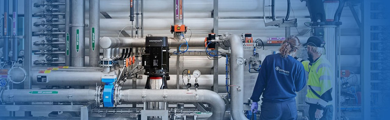 An engineering inspecting steam in a clean working setting