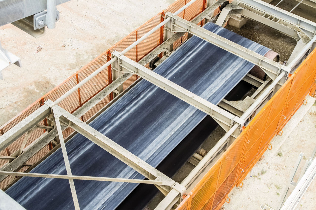 Huge conveyor on a quarry without rocks, looking ready to start the machine